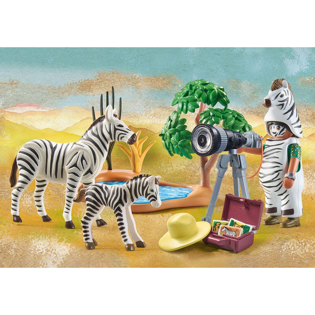 Photographer with Zebras